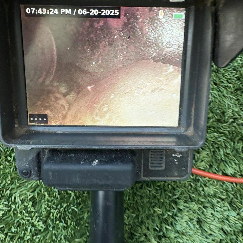 Technician inspecting cleanout and plumbing pipes in San Francisco