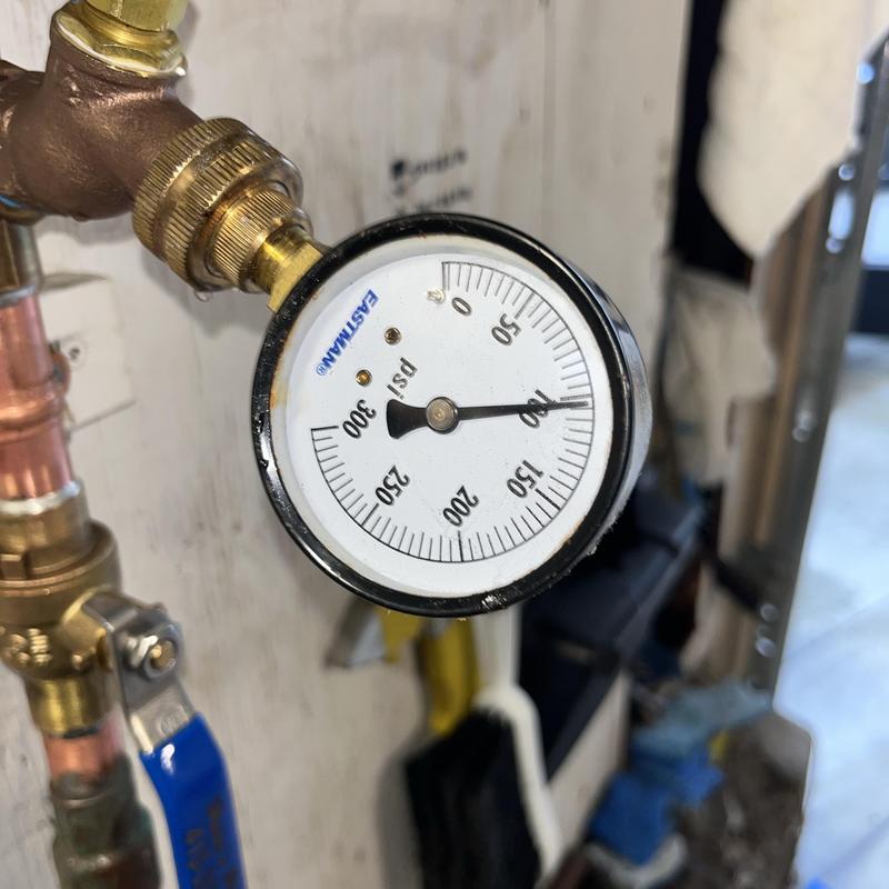 Technician inspecting cleanout and plumbing pipes in San Carlos