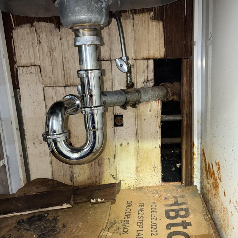 Technician inspecting cleanout and plumbing pipes in San Francisco