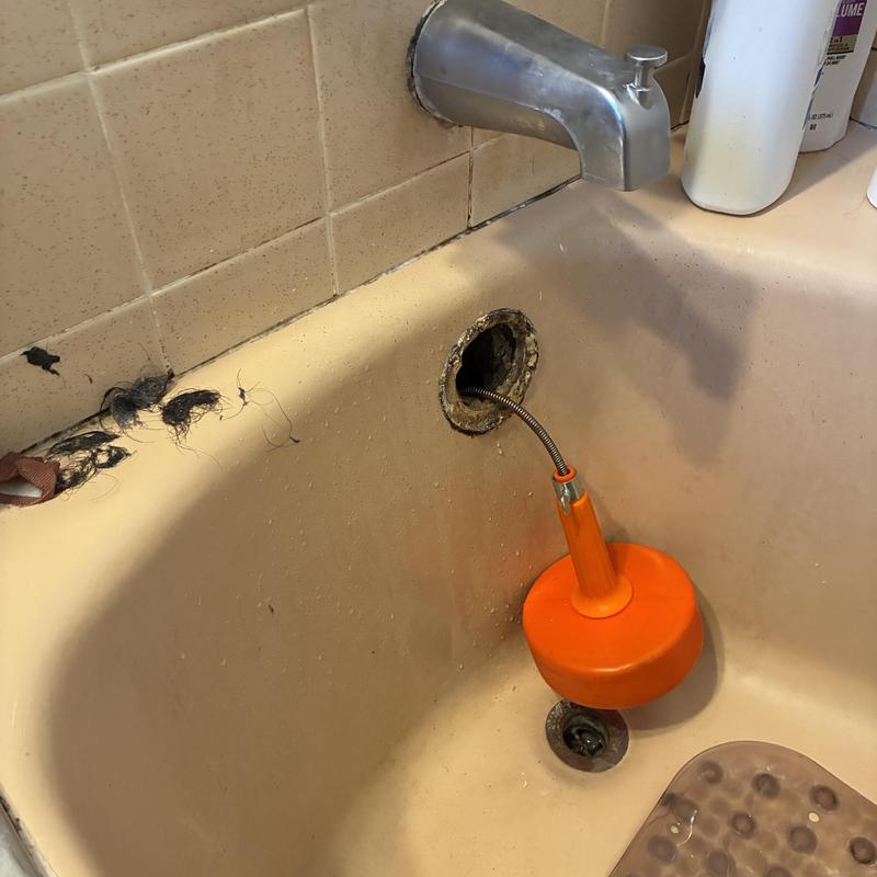 Technician inspecting cleanout and plumbing pipes in San Francisco
