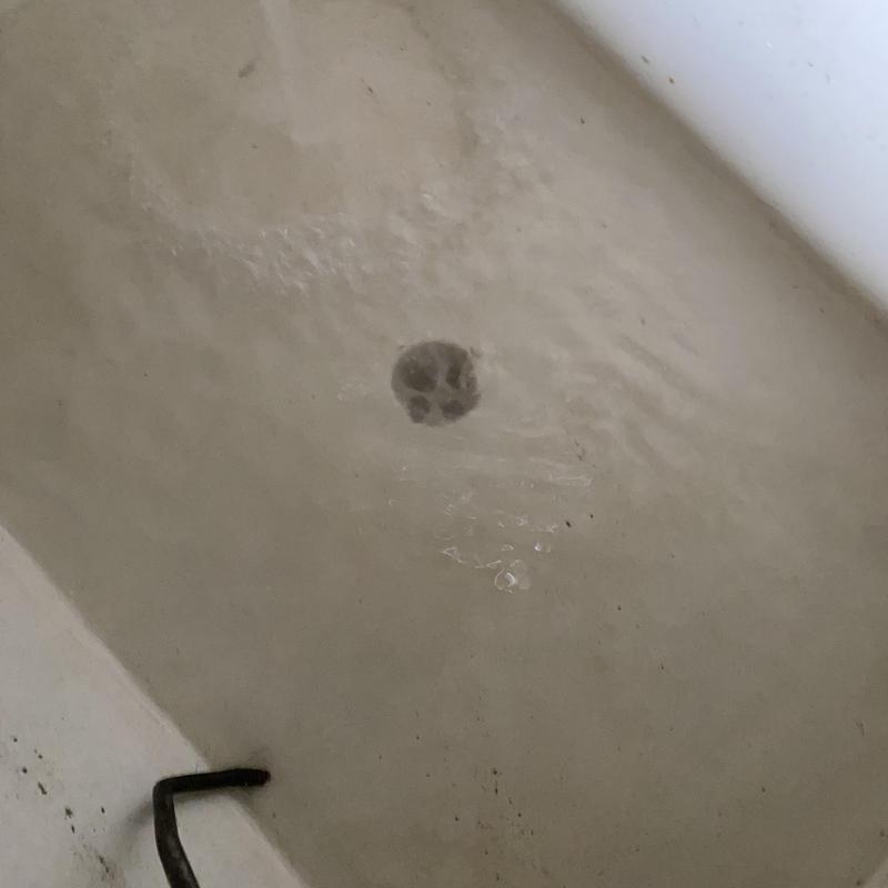 Technician inspecting cleanout and plumbing pipes in San Francisco