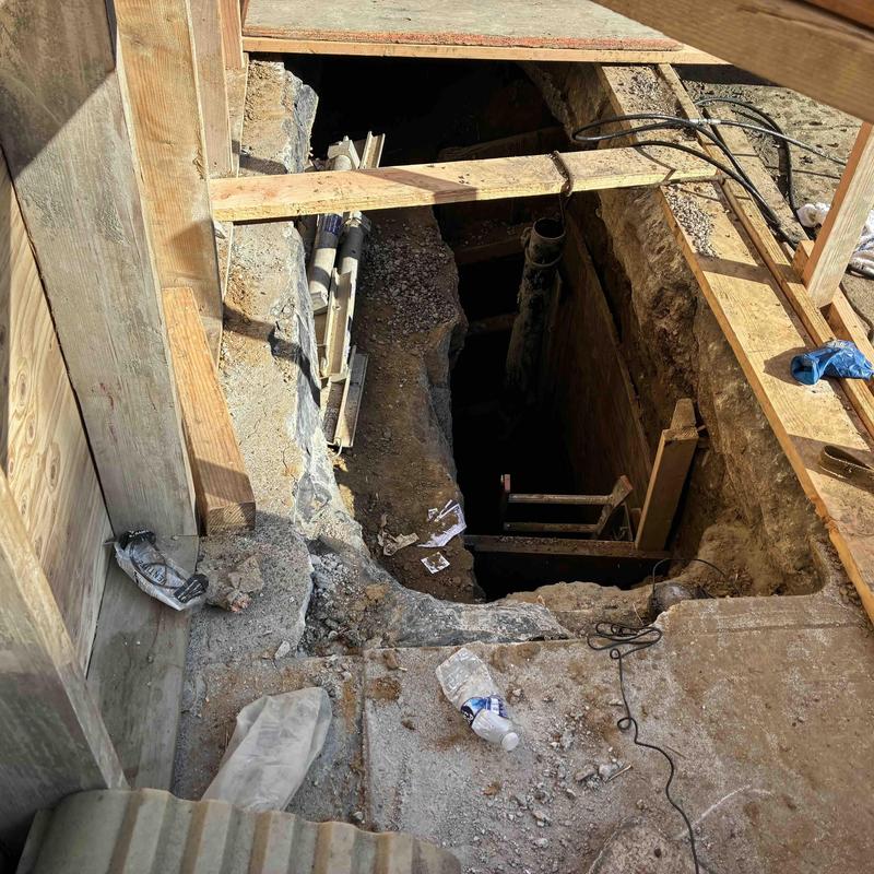 Technician inspecting cleanout and plumbing pipes in San Francisco