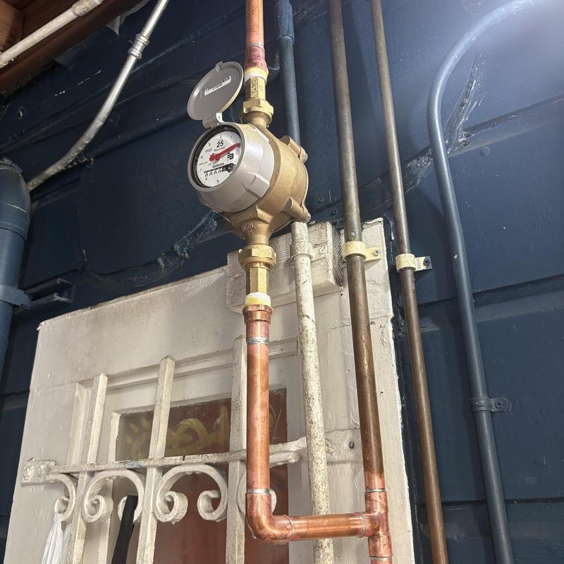 Technician inspecting cleanout and plumbing pipes in San Mateo