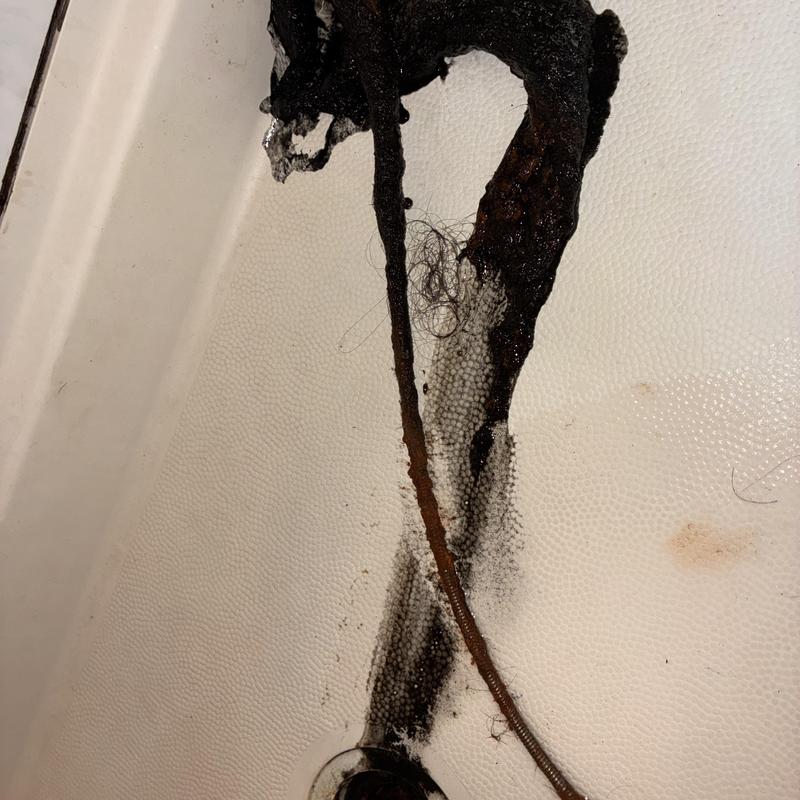 Technician inspecting cleanout and plumbing pipes in San Francisco