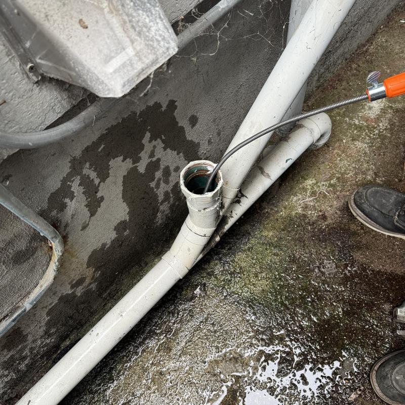 Technician inspecting cleanout and plumbing pipes in San Francisco