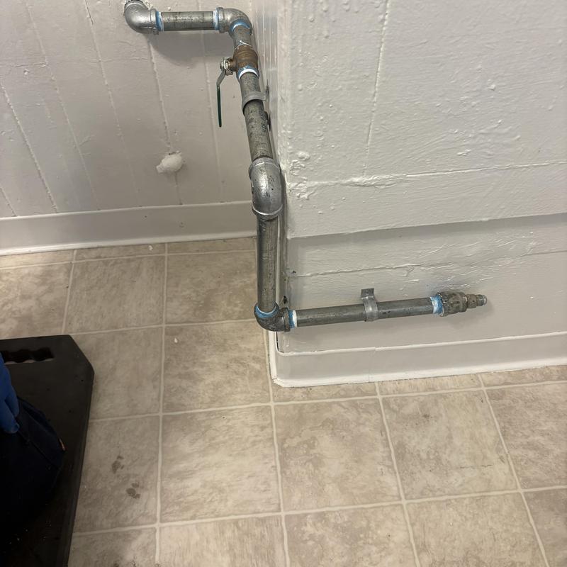Technician inspecting cleanout and plumbing pipes in San Francisco