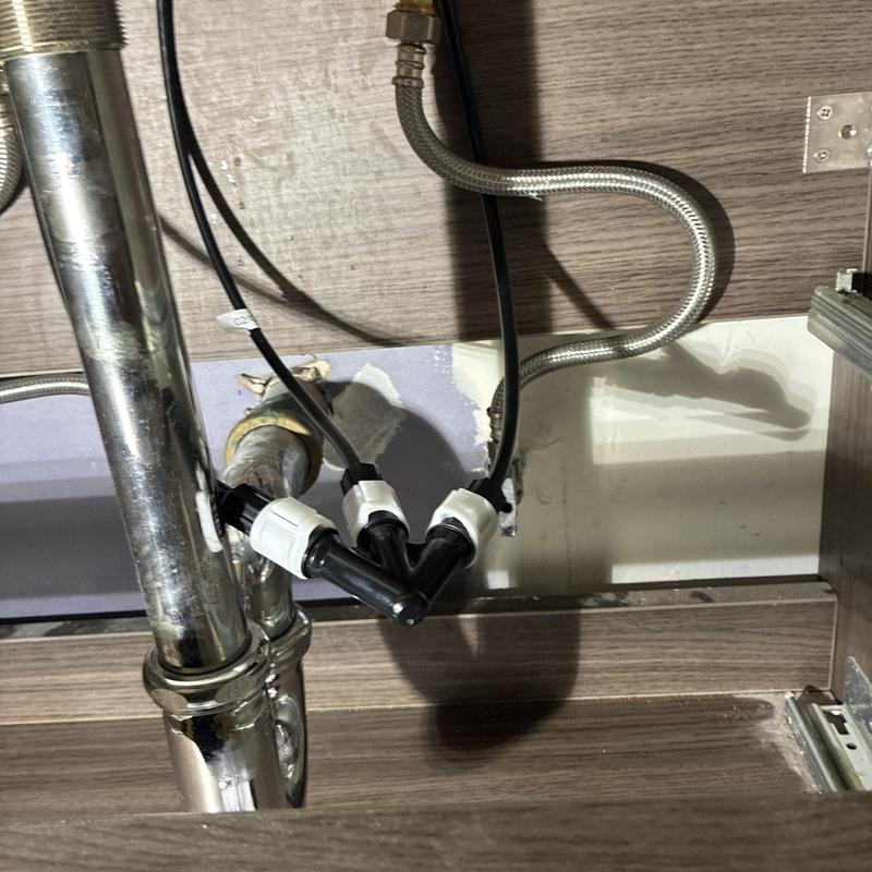 Technician inspecting cleanout and plumbing pipes in San Francisco