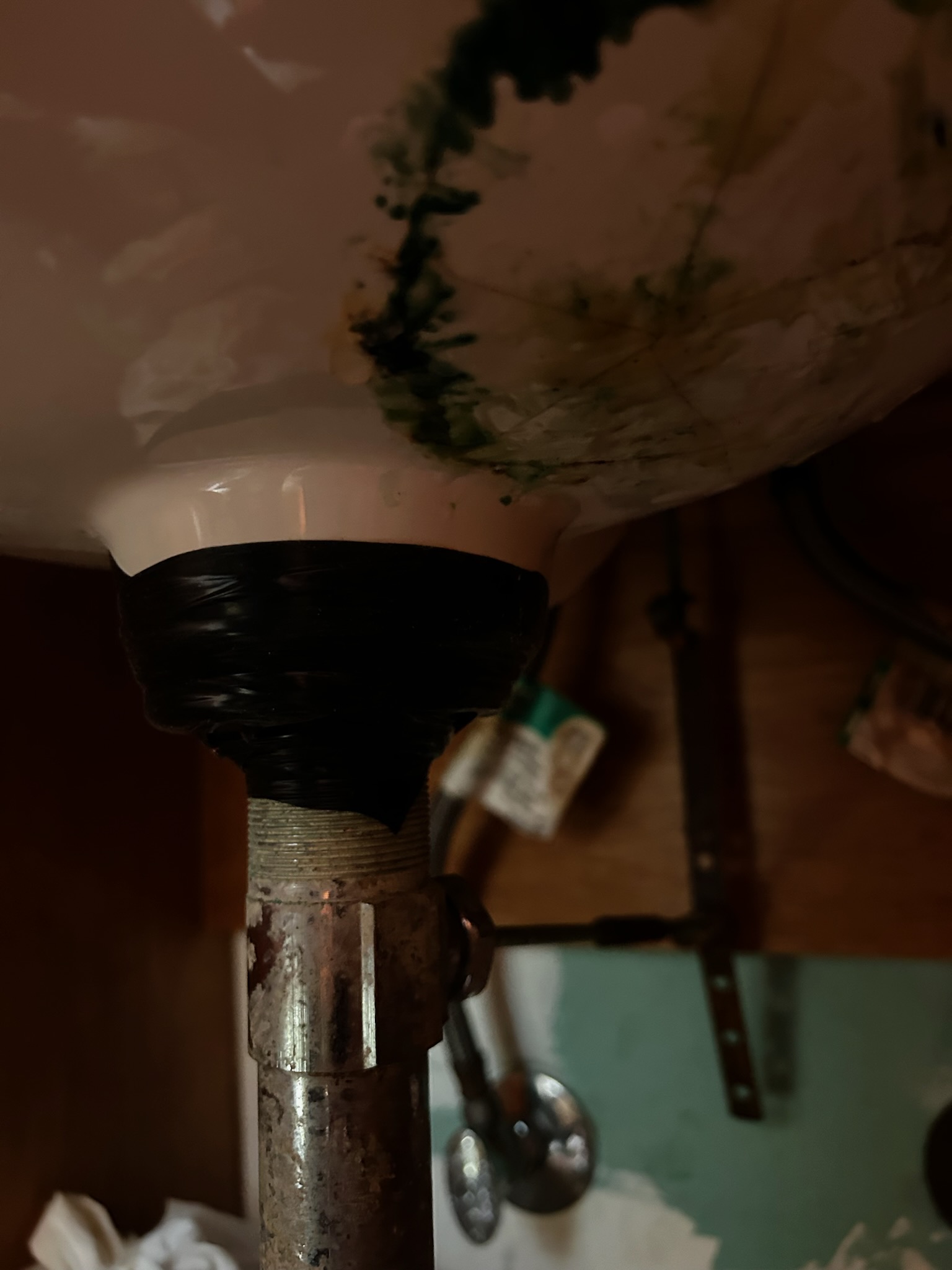 New chrome angle stop valves installed under bathroom basin sink