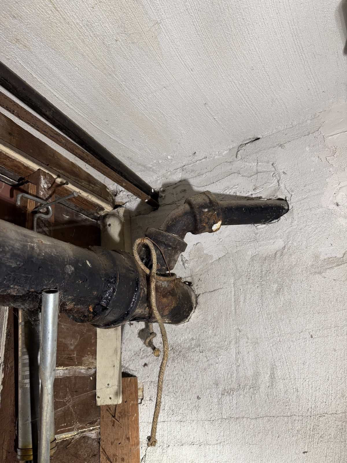 Technician inspecting cleanout and plumbing pipes in San Francisco