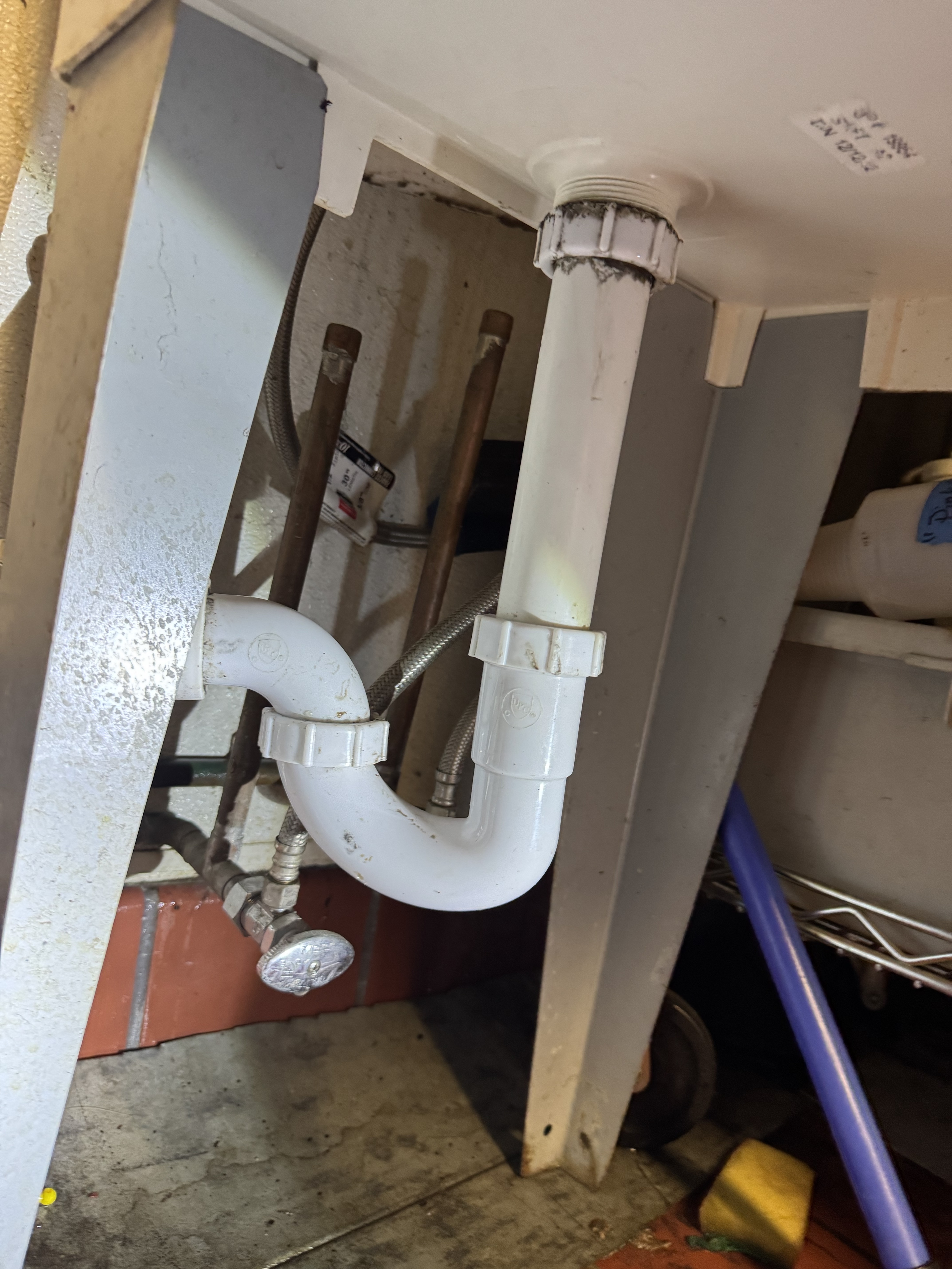Completed leak-free drainage plumbing setup under kitchen sink in Sunset District