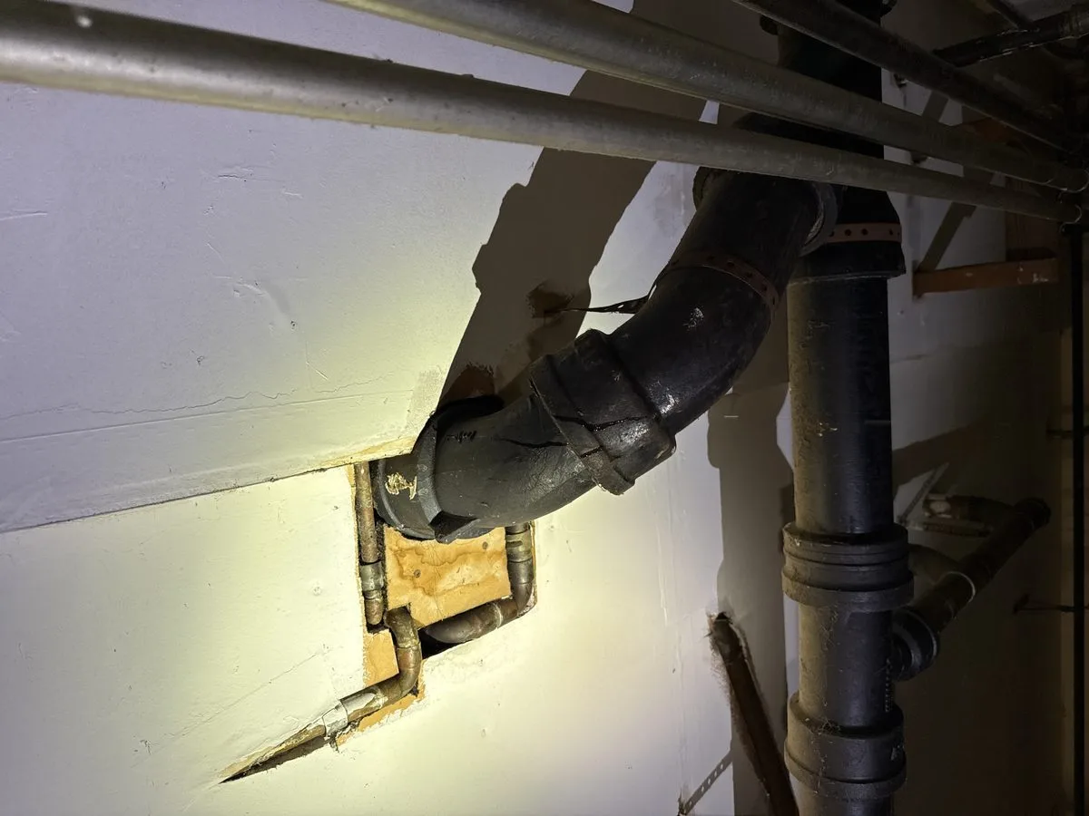 Technician inspecting cleanout and plumbing pipes in San Francisco