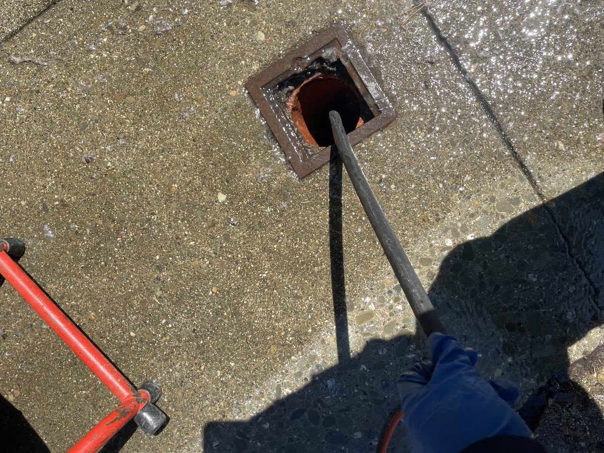 Technician inspecting cleanout and plumbing pipes in San Francisco