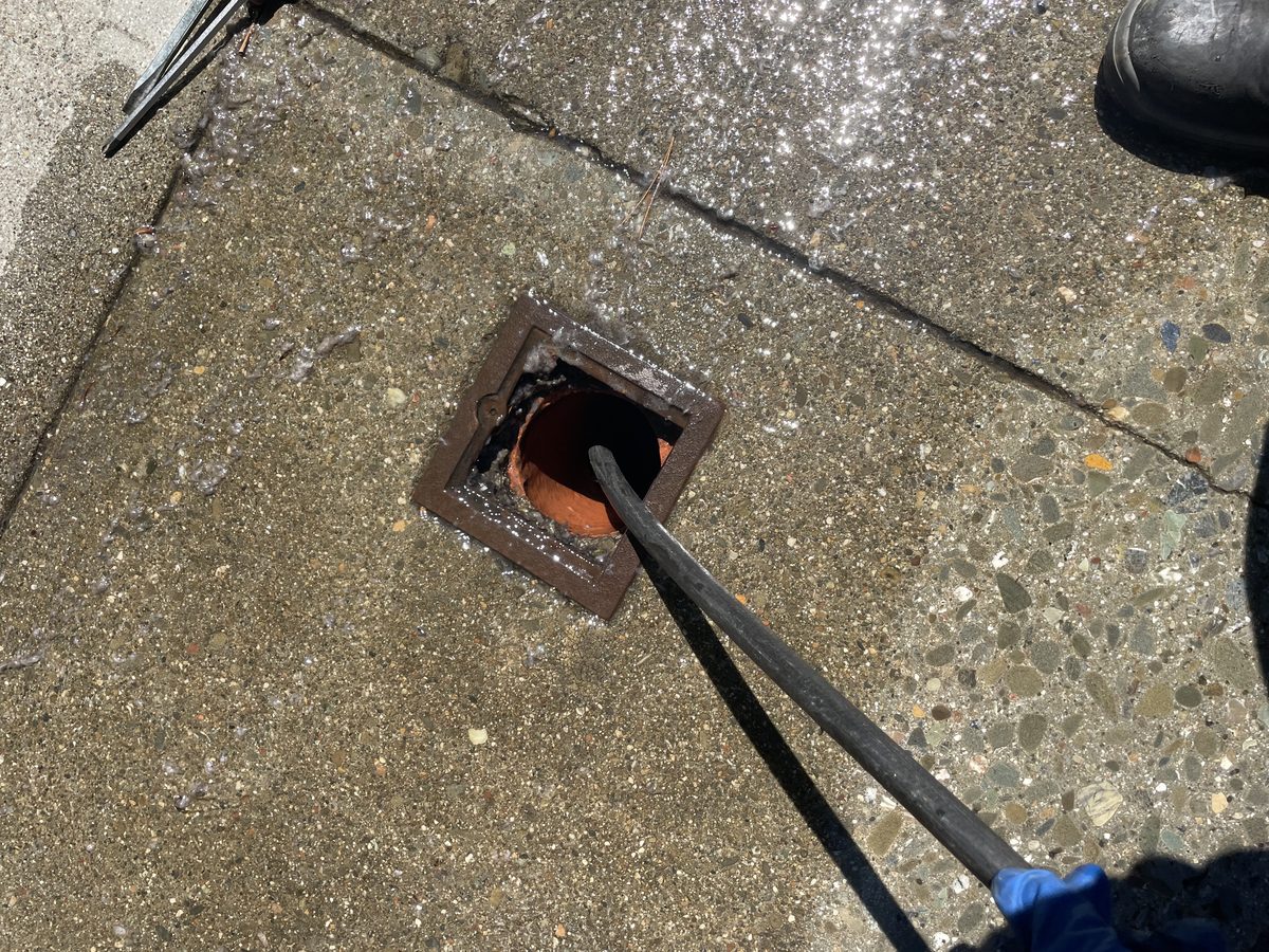 Detailed view of Garage Floor Drain Hydro Jetting setup by Heise's Plumbing