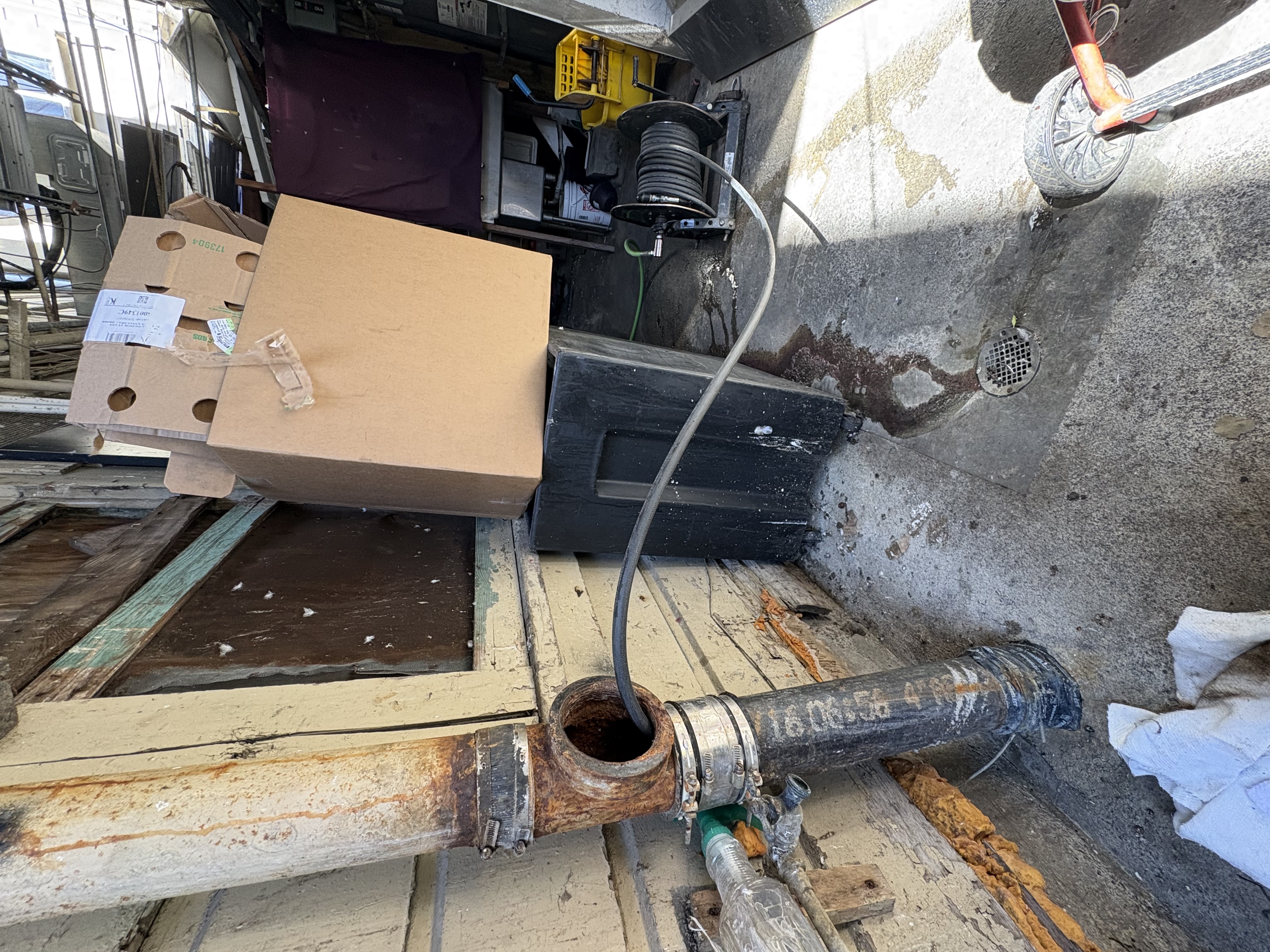 Technician inspecting cleanout and plumbing pipes in South San Francisco