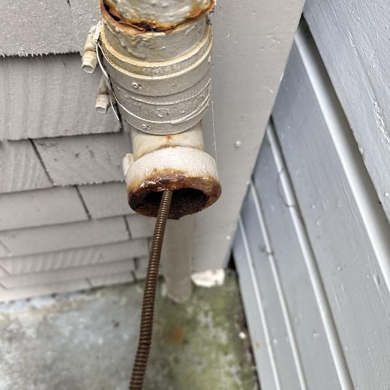 Technician inspecting cleanout and plumbing pipes in San Francisco
