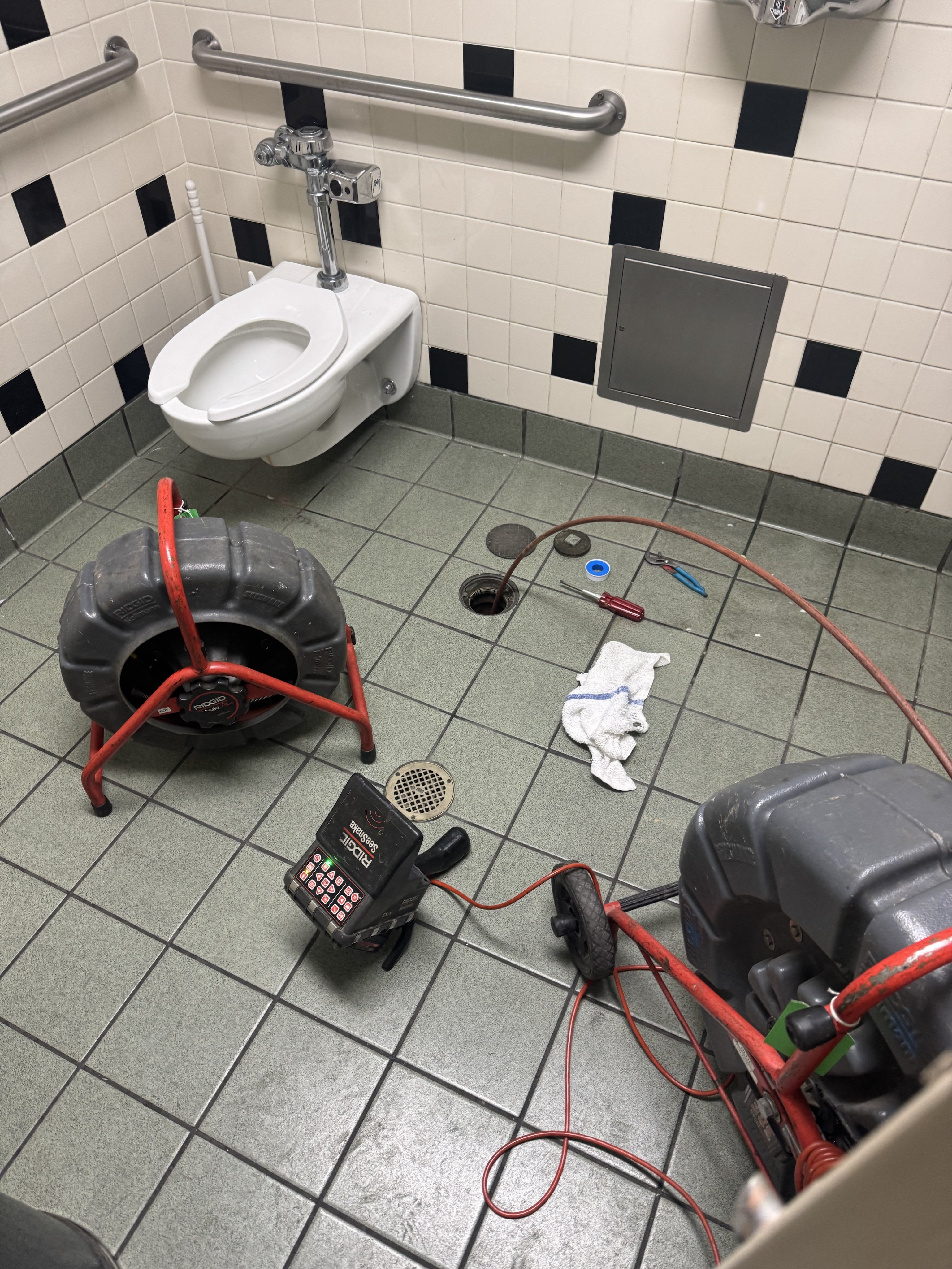 Technician inspecting cleanout and plumbing pipes in Daly City