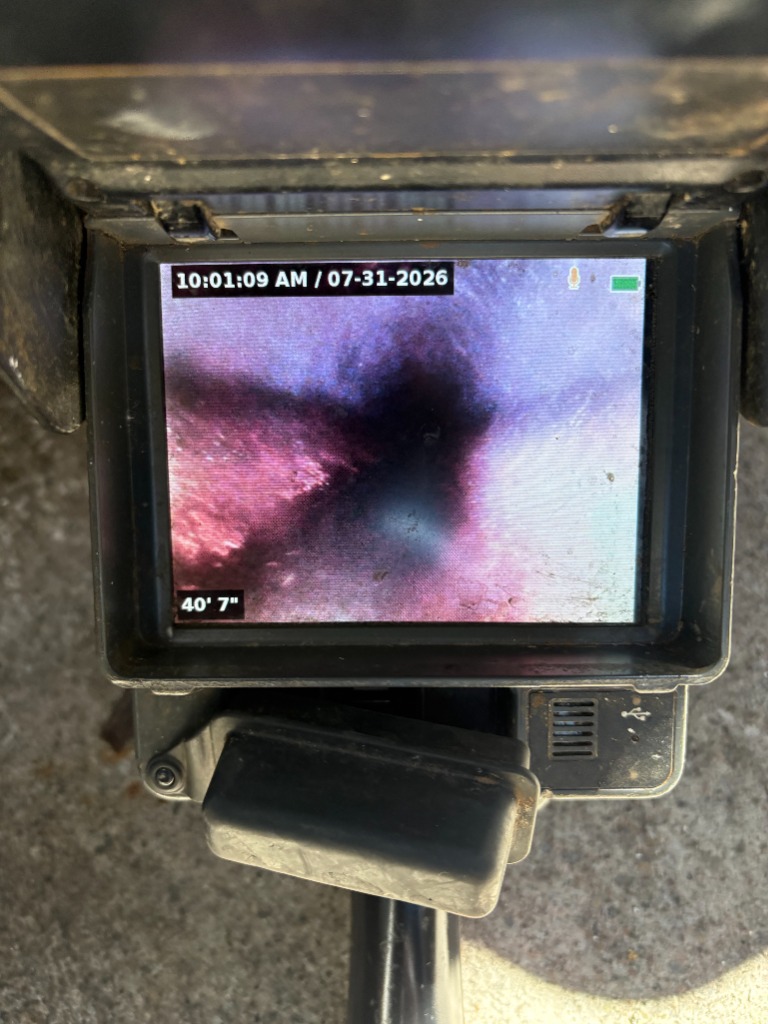 Real-time sewer camera monitor showing root intrusion