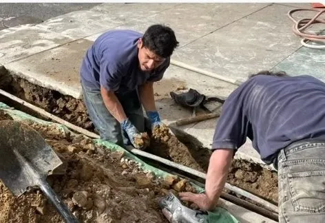 Heise's Plumbing workers excavating for water and sewer line repair in San Francisco