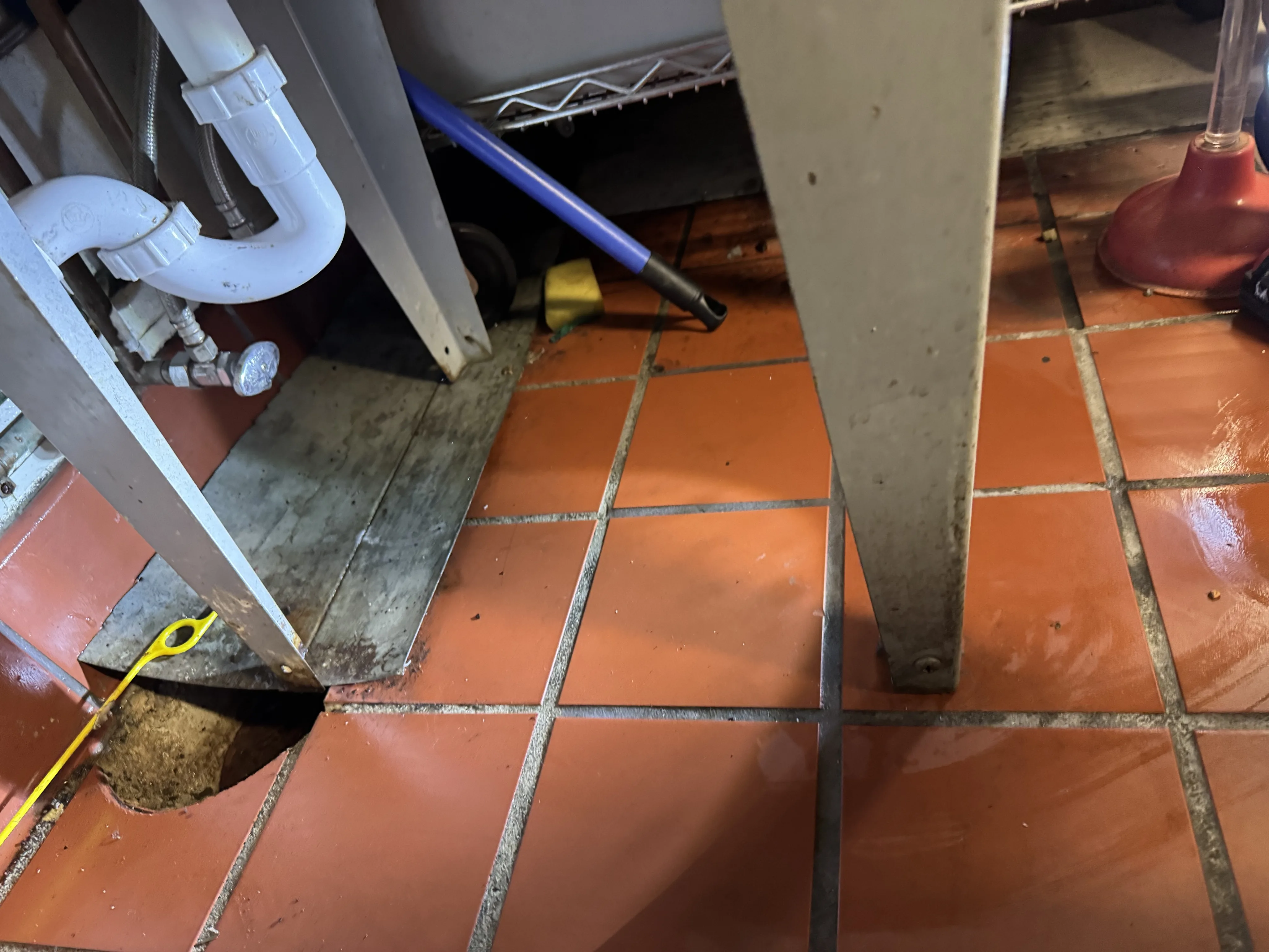 Garbage disposal and under-sink plumbing installation