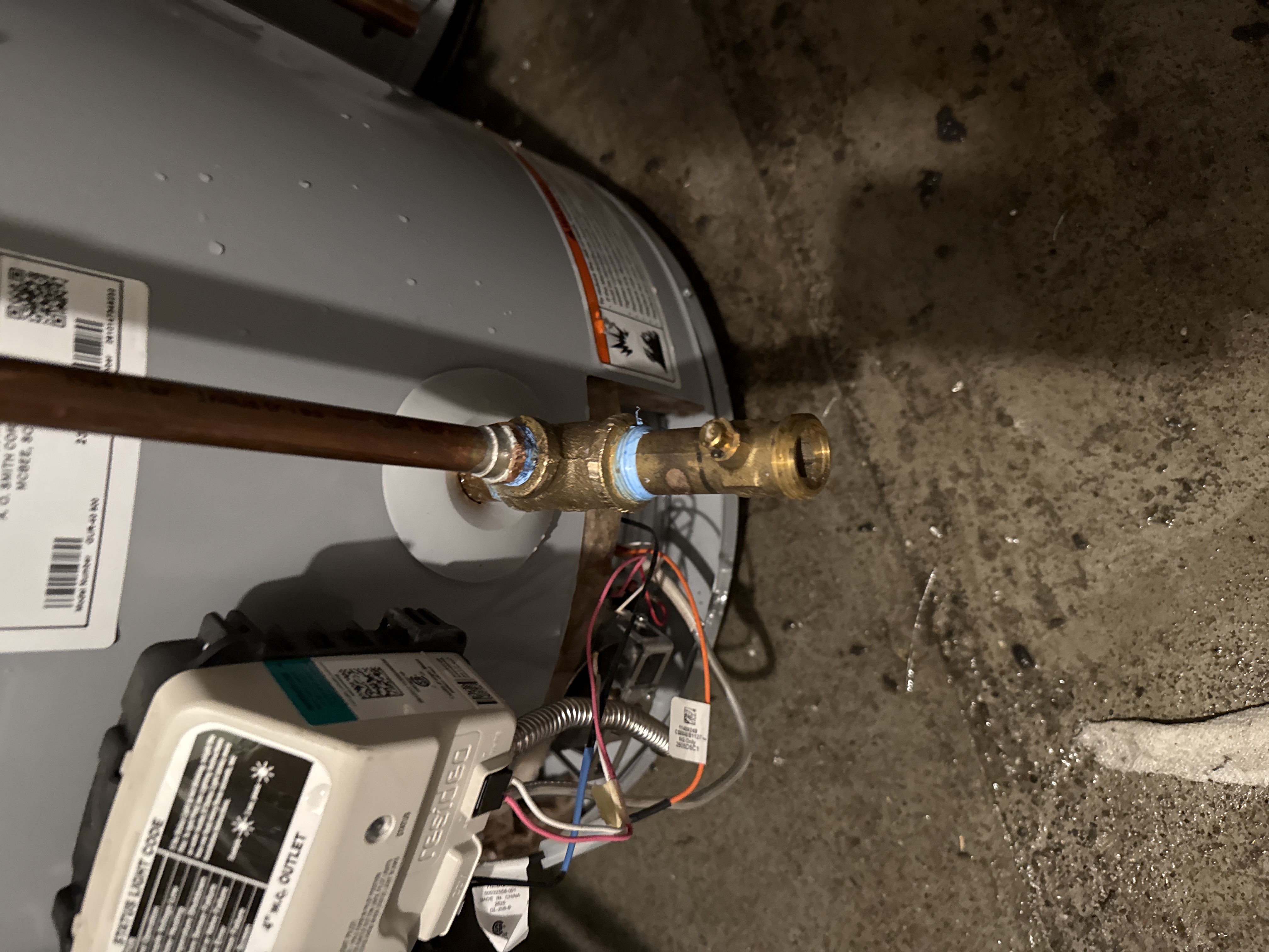 Inspecting water heater flue venting and draft hood clearance